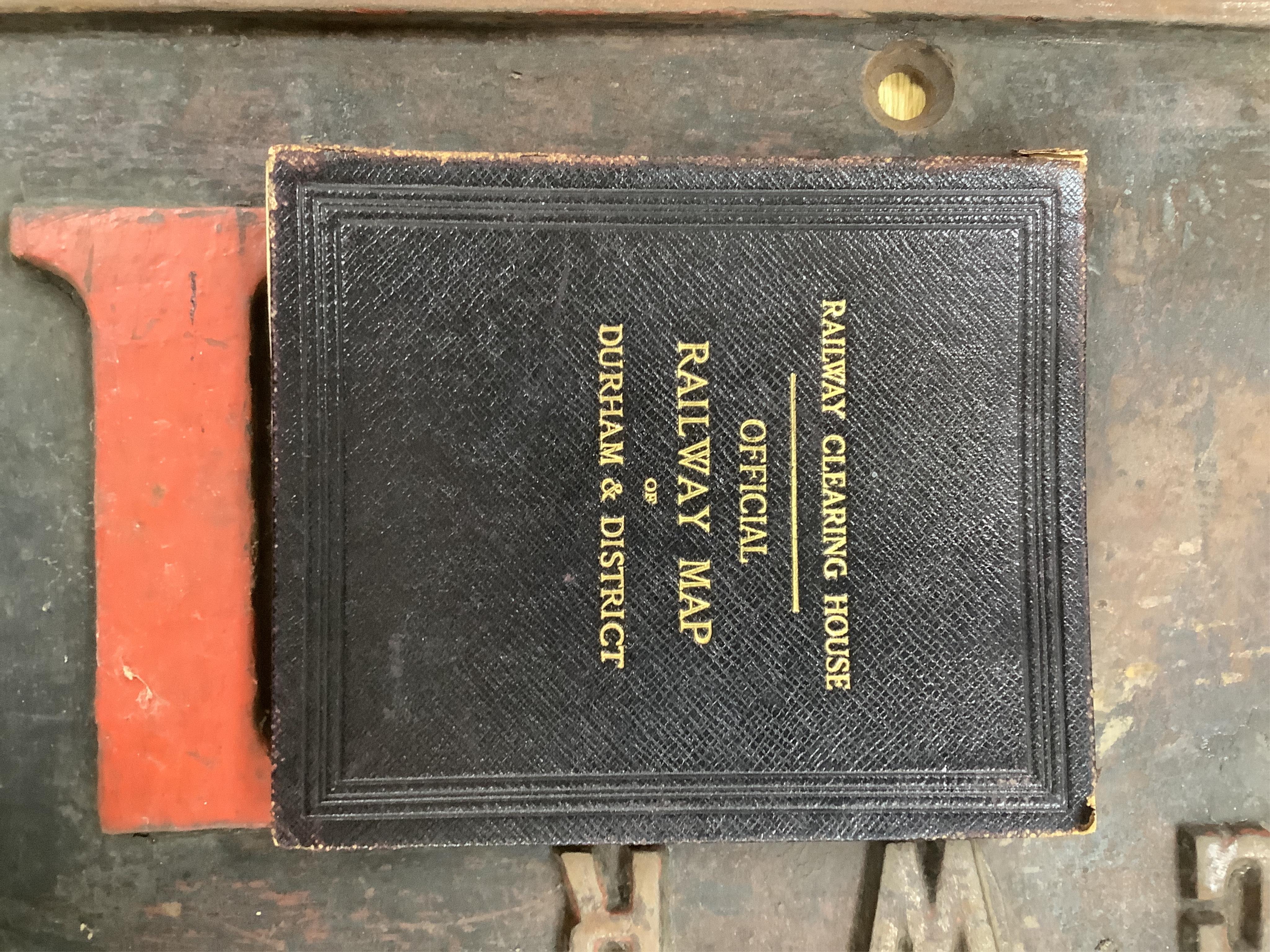 A collection of Railwayana, including a number of London Transport folding pocket maps, a hardback Railway Clearing House Official Railway Map of Durham and District dated 1914 and laid on canvas